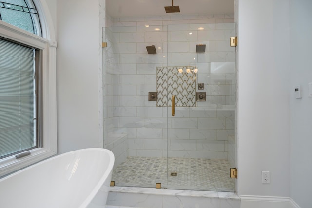 bathroom with separate shower and tub