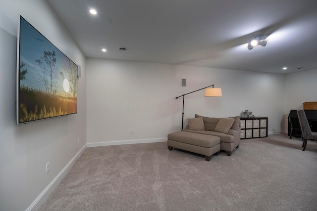 living area with light colored carpet