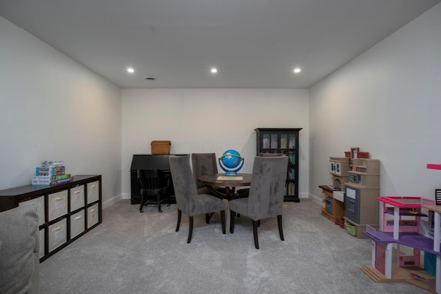 dining space with light carpet