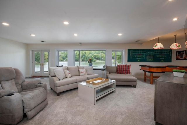 living room featuring light carpet and french doors