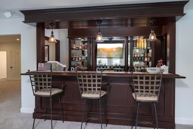 bar featuring carpet flooring and pendant lighting