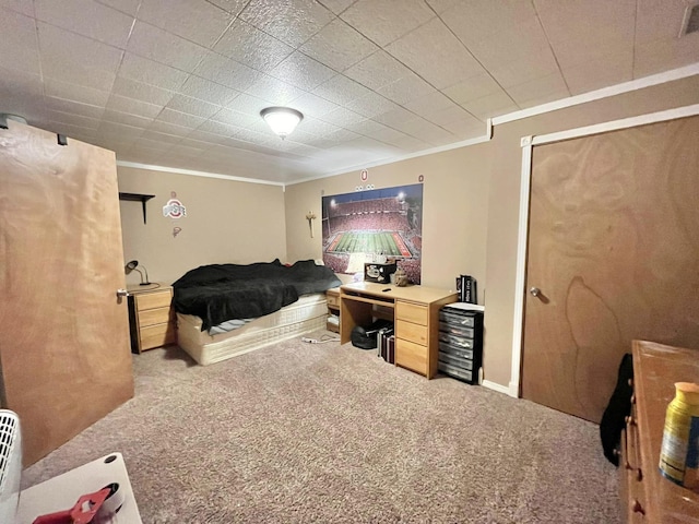 bedroom with light colored carpet and crown molding