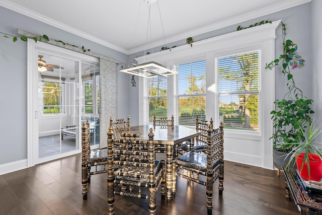 dining area featuring dark hardwood / wood-style floors, ceiling fan, crown molding, and a wealth of natural light