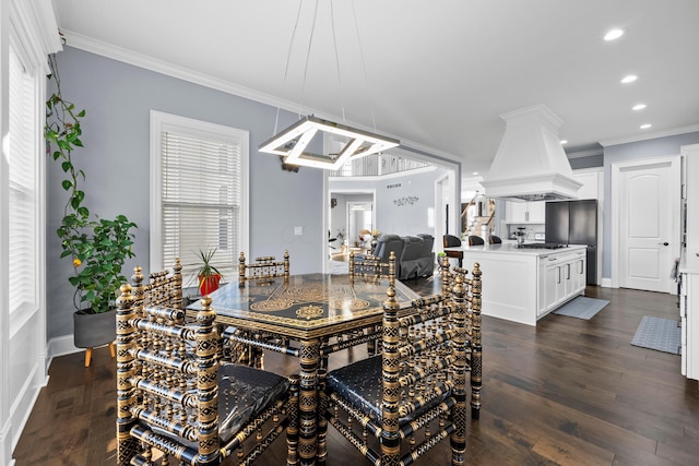 dining space with dark hardwood / wood-style flooring and ornamental molding