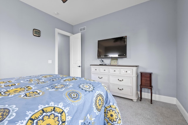 bedroom with light colored carpet and ceiling fan