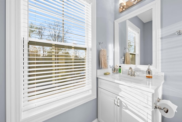 bathroom featuring vanity and a wealth of natural light