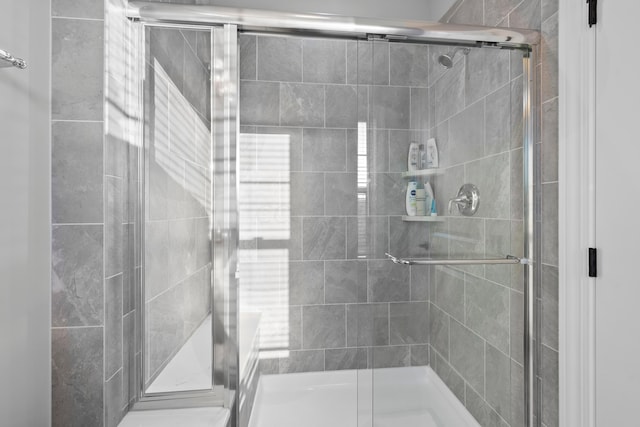 bathroom with an enclosed shower