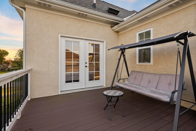 deck at dusk with french doors