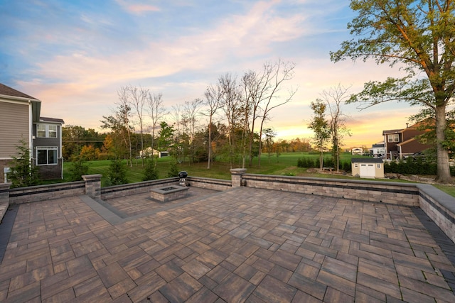 view of patio terrace at dusk