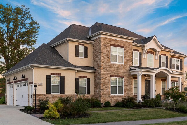 view of front facade with a front yard and a garage