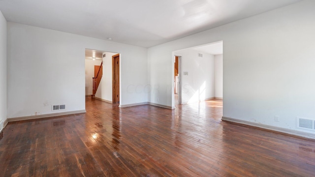 empty room featuring dark wood-type flooring