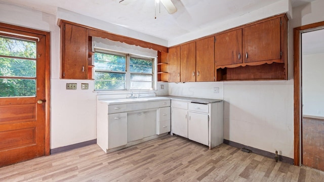 kitchen with light hardwood / wood-style flooring, ceiling fan, and a healthy amount of sunlight