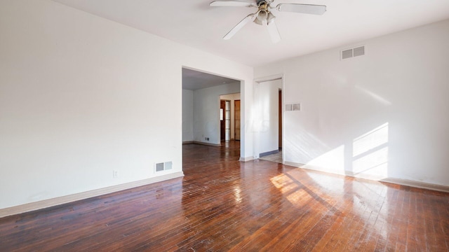 spare room featuring ceiling fan and dark wood-type flooring