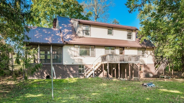 back of house with a yard and a deck