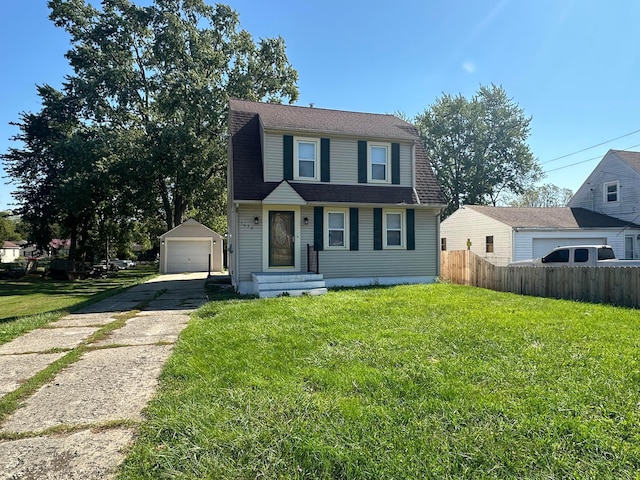 view of front of property featuring an outbuilding, a garage, and a front lawn