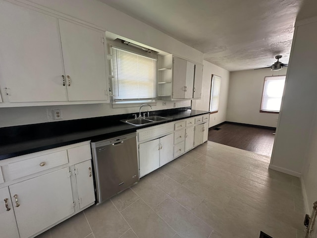 kitchen with stainless steel dishwasher, ceiling fan, sink, light hardwood / wood-style floors, and white cabinetry