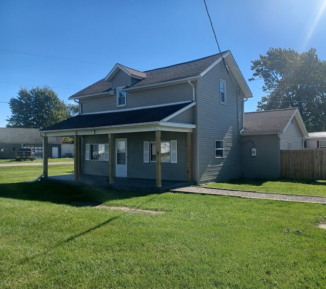 exterior space with a porch and a lawn