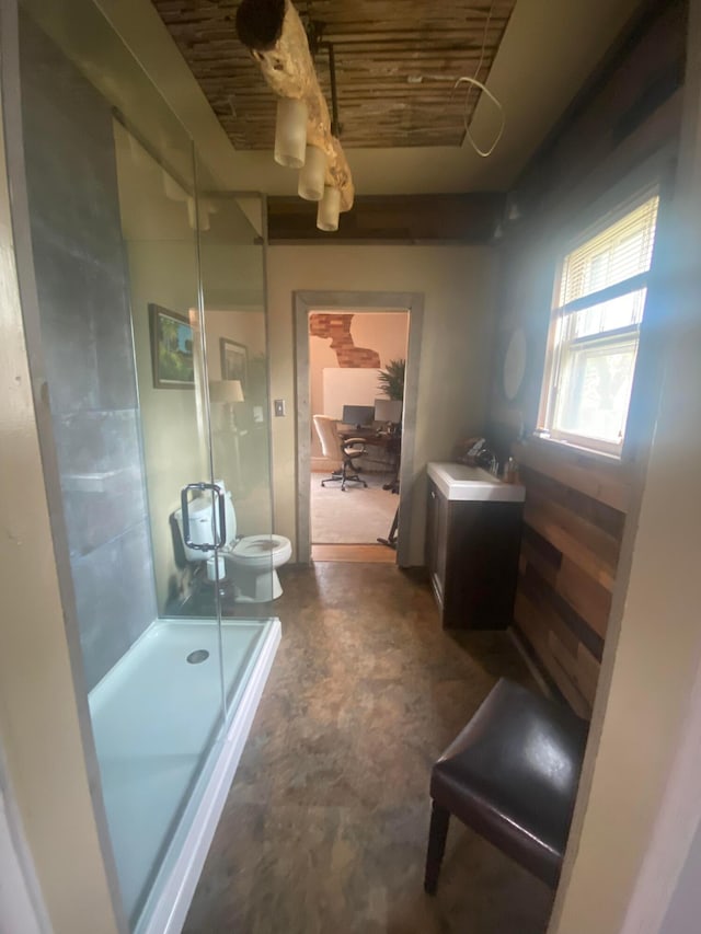 bathroom with an enclosed shower, concrete flooring, vanity, a bidet, and toilet