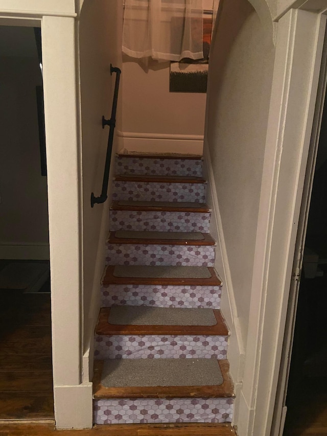 stairs with wood-type flooring