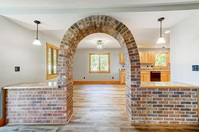 interior space featuring sink and light hardwood / wood-style floors