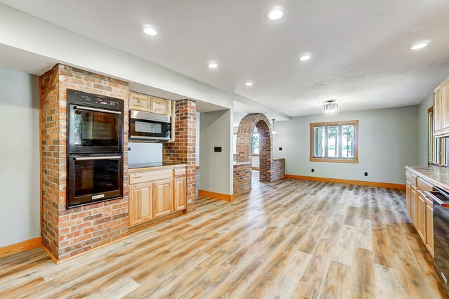 kitchen with light hardwood / wood-style flooring and stainless steel appliances