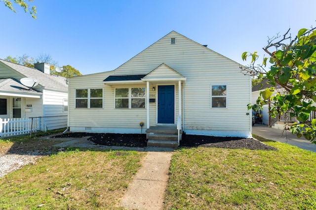 bungalow with a front yard