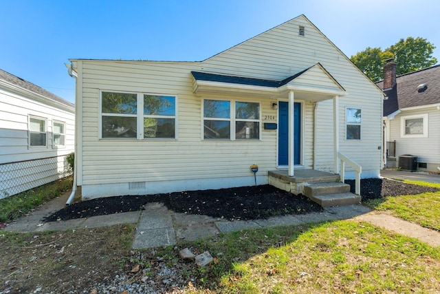 bungalow-style home featuring cooling unit