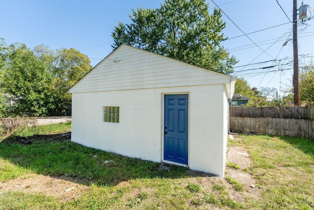 view of outbuilding with a yard