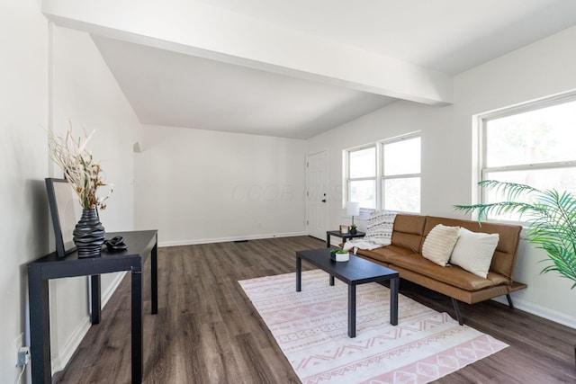 living room featuring vaulted ceiling with beams and dark wood-type flooring