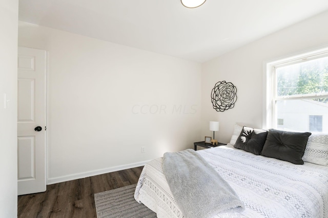 bedroom featuring dark hardwood / wood-style floors