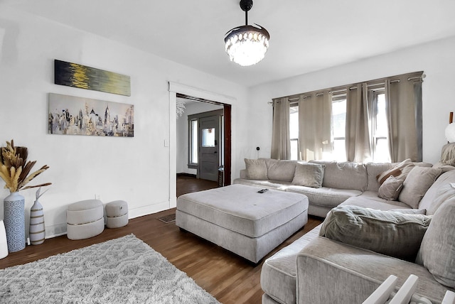 living room featuring dark wood-type flooring