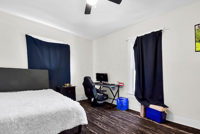 bedroom featuring ceiling fan and dark hardwood / wood-style floors