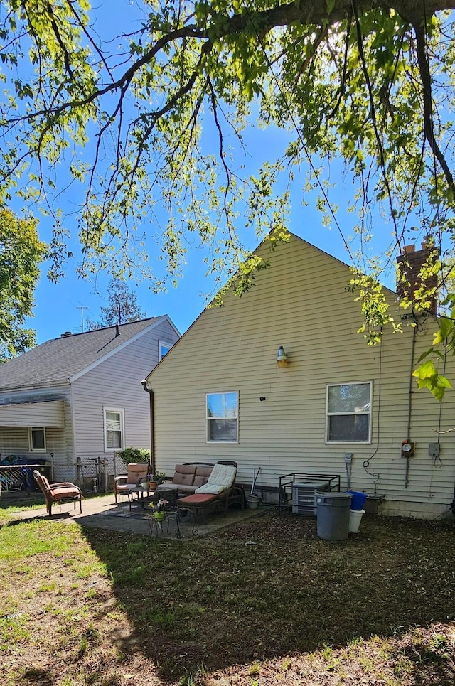 rear view of property with a patio area