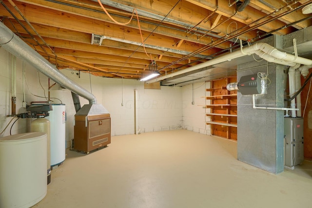 basement with electric water heater and heating unit