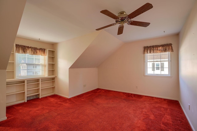 bonus room featuring ceiling fan, carpet floors, and lofted ceiling