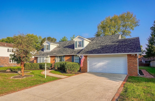 cape cod house featuring a garage and a front lawn