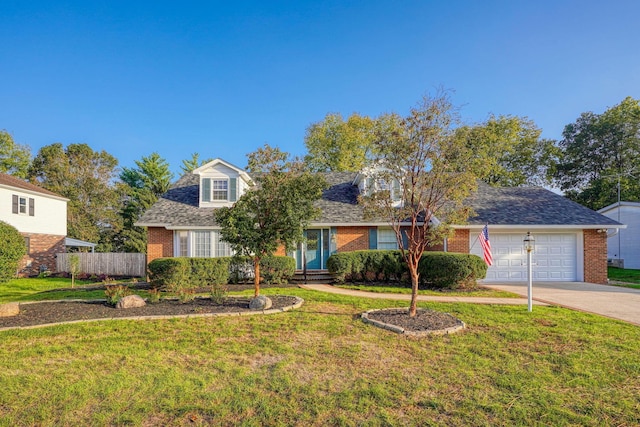 view of front of house featuring a front yard and a garage