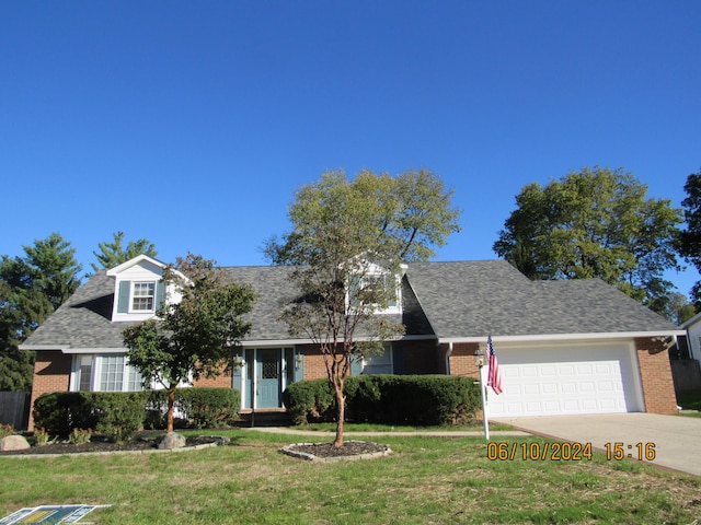 cape cod house featuring a garage and a front yard