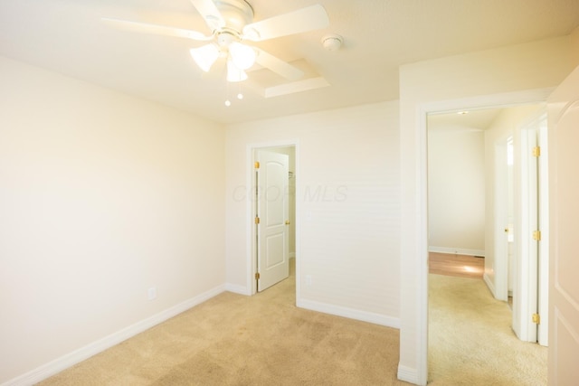 unfurnished bedroom with light carpet and ceiling fan