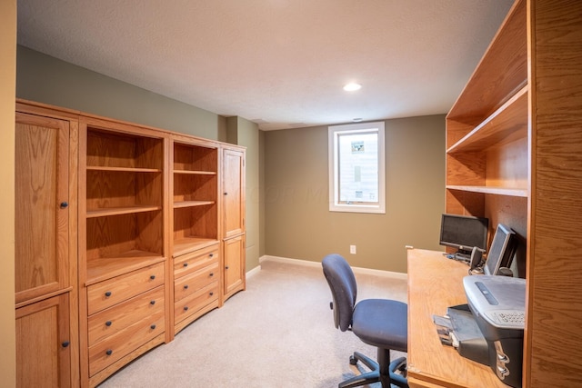 office space with light colored carpet and a textured ceiling