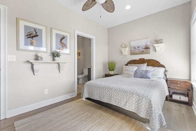 bedroom featuring wood-type flooring, ensuite bath, and ceiling fan