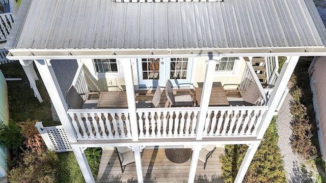 rear view of property with outdoor lounge area and a wooden deck