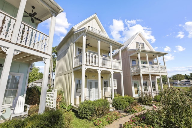 view of front of property with ceiling fan and a balcony