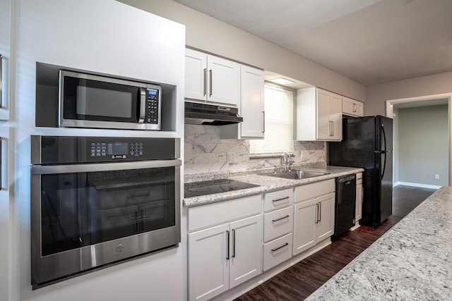 kitchen with black appliances, sink, tasteful backsplash, dark hardwood / wood-style flooring, and white cabinetry