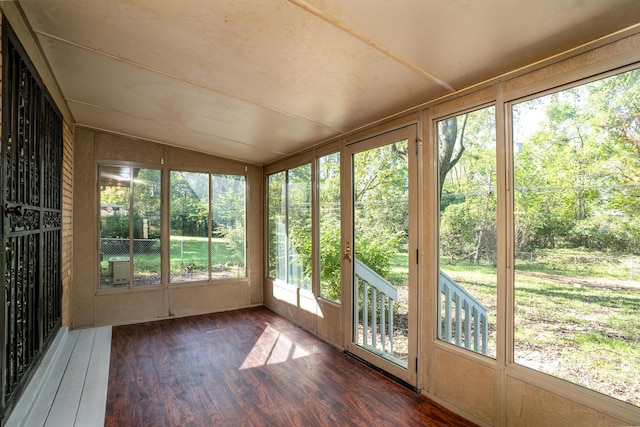 unfurnished sunroom with lofted ceiling