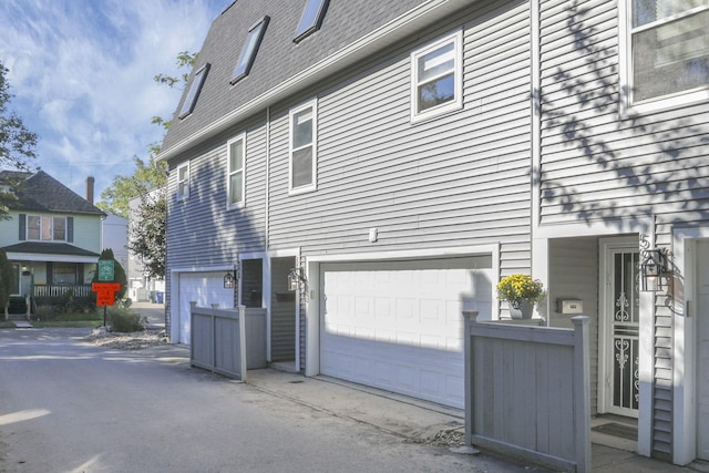 view of side of home featuring a garage