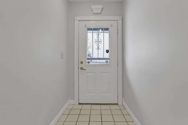 entryway with light tile patterned flooring