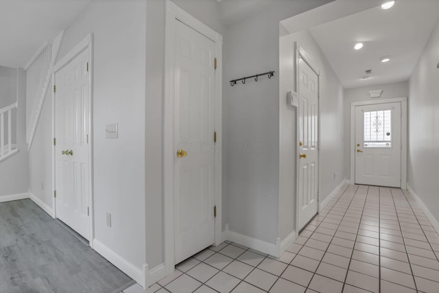 foyer entrance featuring light tile patterned flooring