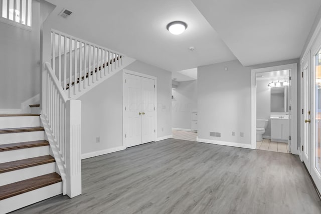 unfurnished living room with hardwood / wood-style floors