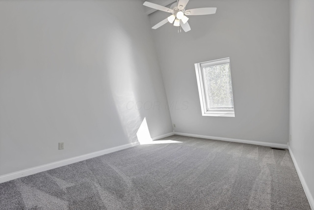 spare room with ceiling fan and carpet floors